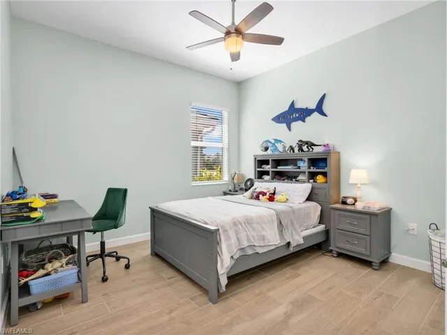 Bedroom featuring light wood finished floors and ceiling fan