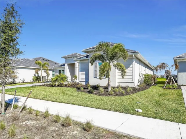 View of home's exterior with a yard