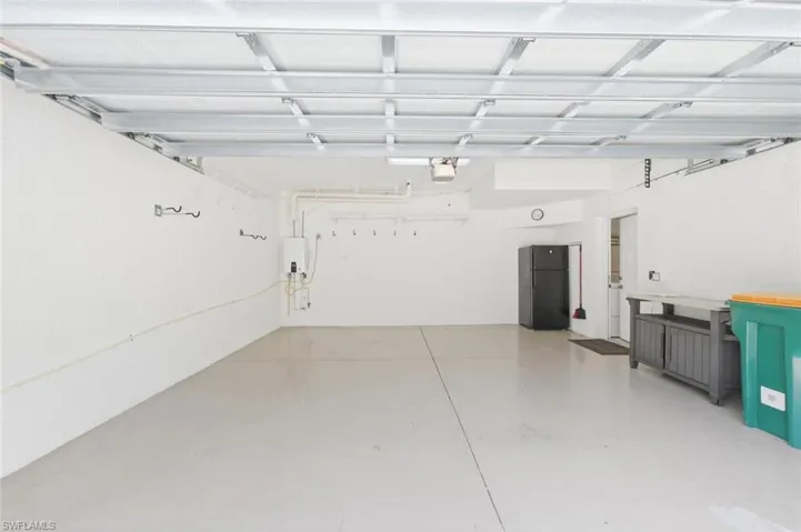 Attached 2 car garage with a brand new Tankless Natural Gas Hot Water Heater