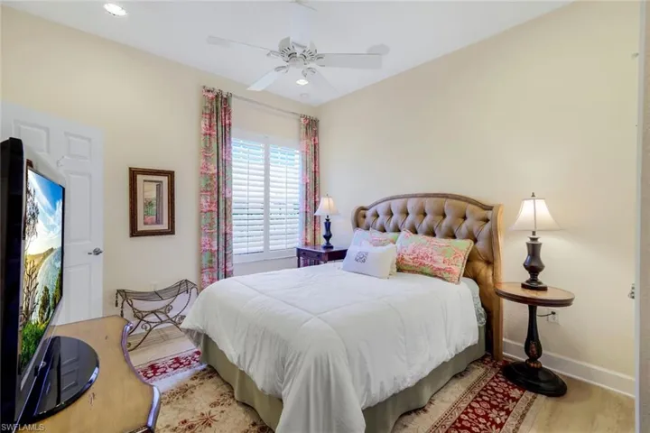 Bedroom featuring light hardwood / wood-style floors and ceiling fan