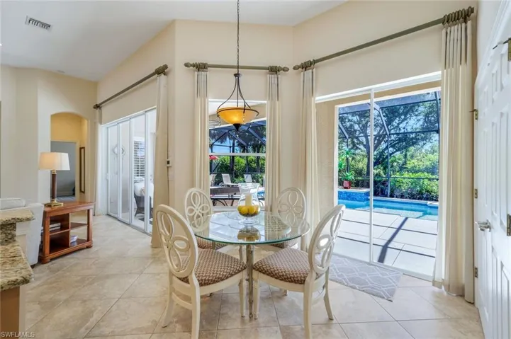 Dining area featuring light tile patterned floors