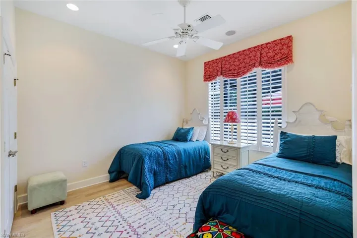 Bedroom with light wood-type flooring and ceiling fan