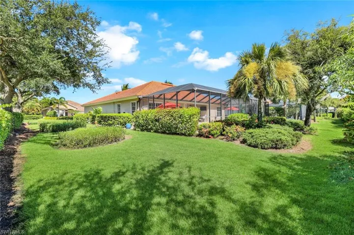 View of yard with a lanai