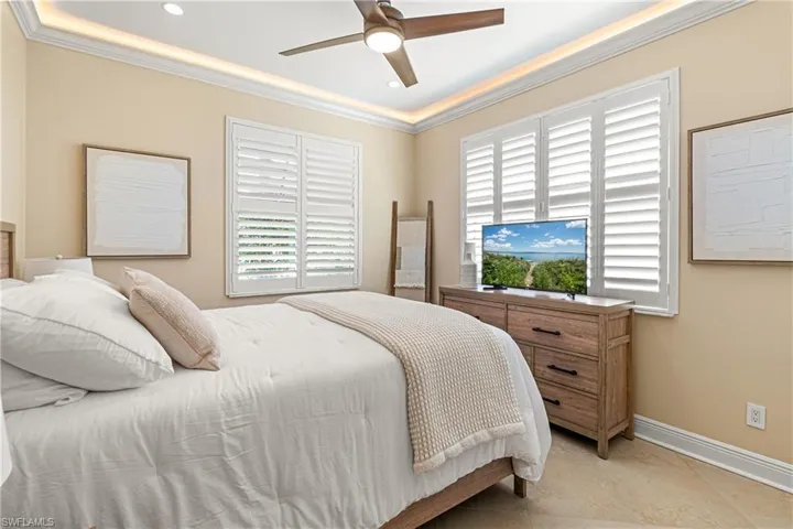 GUEST BEDROOM #2 IS LARGE & ALSO HAS CEILING TRIM LIGHTING, PLANTATION SHUTTERS & TILE FLOORING!