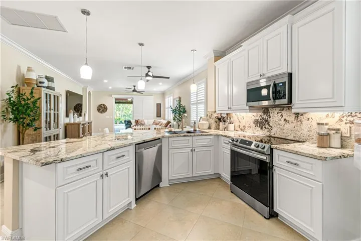 MODERN WHITE CABINETRY WITH ALL NEW HARDWARE INSTALLED IN 2024 PLUS NEW STOVE & MICROWAVE IN 2025.
