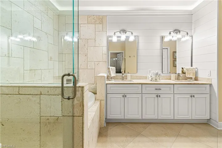 GREAT VIEW OF YOUR MASTER BATHROOM WITH DOUBLE VANITY SINKS PLUS SHIP LAP & GREAT LIGHTING! TRULY BEAUTIFUL!