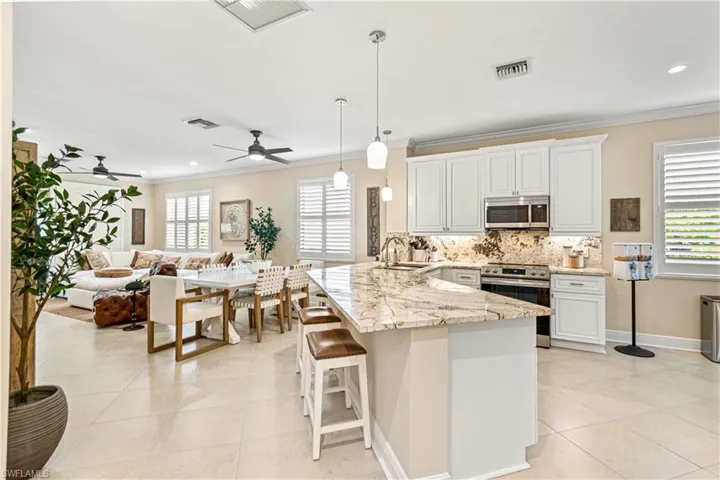 TOTALLY OPEN CONCEPT WITH UPDATED FANS & LIGHTING PLUS PLANTATION SHUTTERS & CROWN MOLDING!