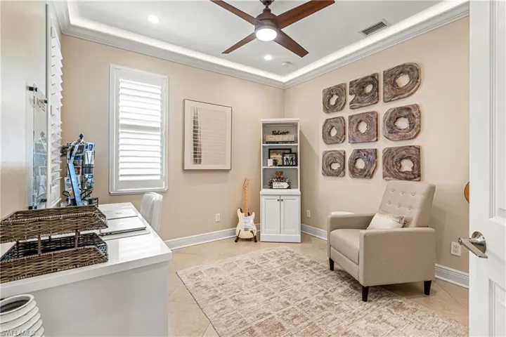 THIS BEAUTIFUL & LARGE GUEST BEDROOM ALSO HAS CEILING TRIM LIGHTING, PLANTATION SHUTTERS, TILE FLOORING & IS CURRENTLY SET-UP AS AN OFFICE!