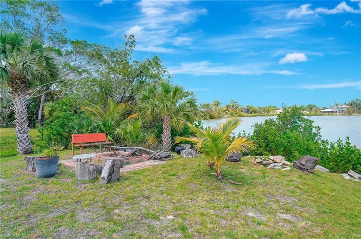 View of yard with a water view