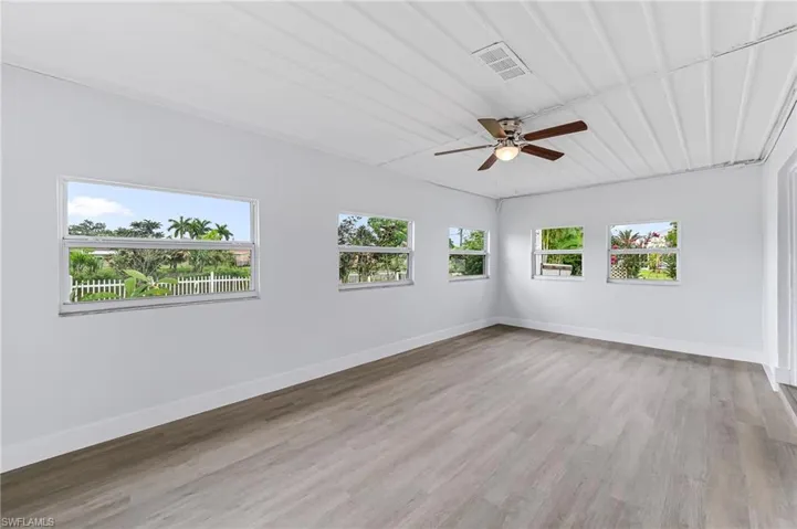 Spare room with ceiling fan and hardwood / wood-style floors
