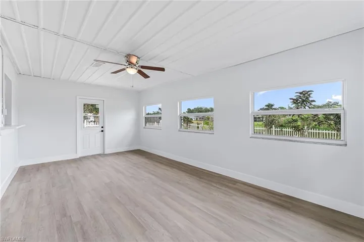 Spare room with light hardwood / wood-style flooring and ceiling fan