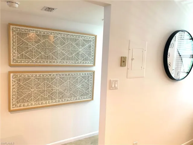 Detailed view of electric panel and baseboards