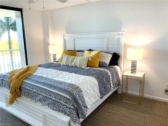 Bedroom with carpet floors and access to exterior