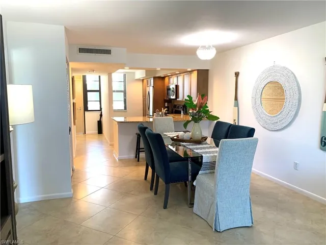 Dining area featuring light tile patterned flooring