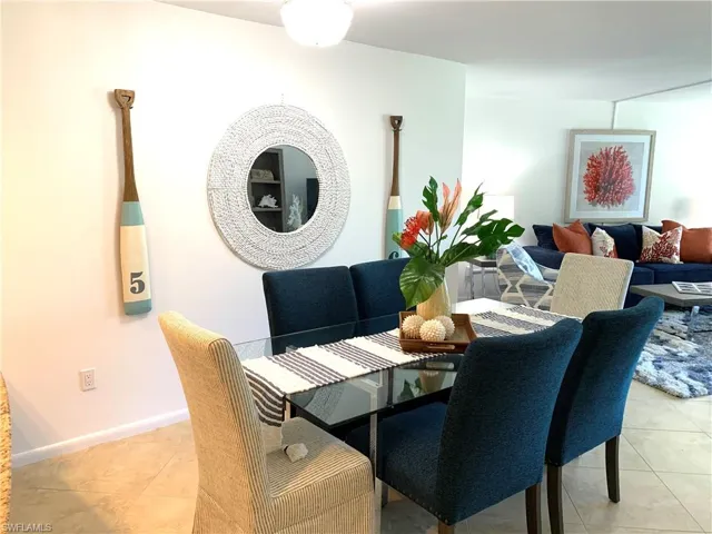 Dining area featuring light tile patterned floors