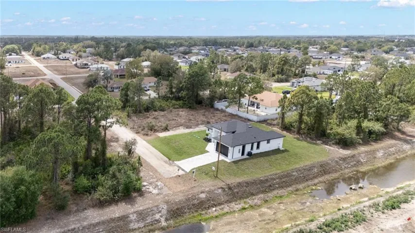 Aerial view of residential area with a large body of water