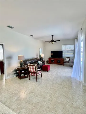 Living room featuring ceiling fan