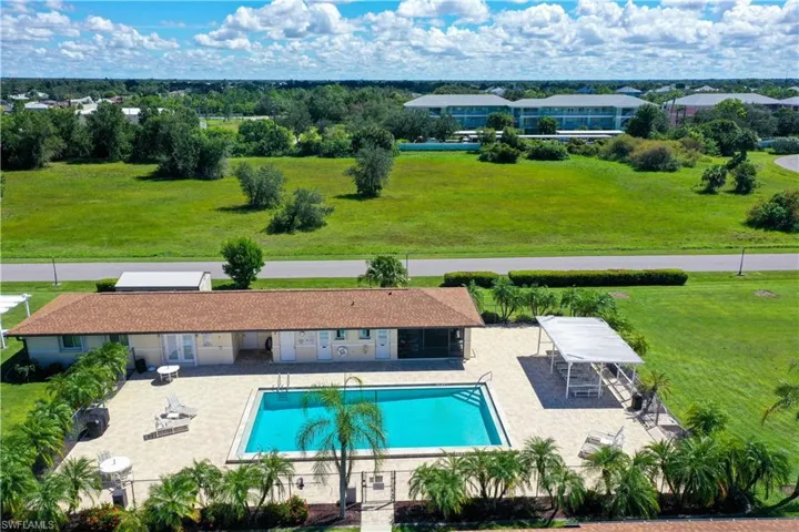Community pool with a patio