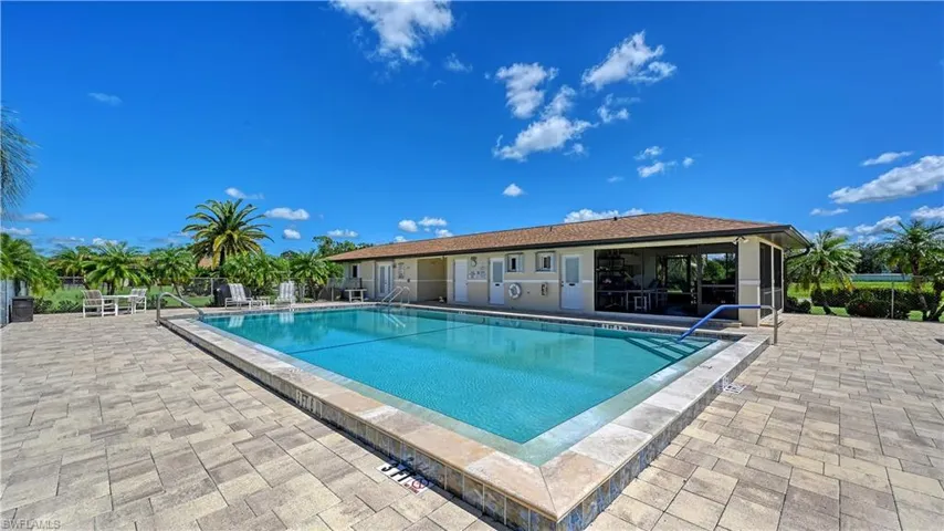 Community pool featuring a patio