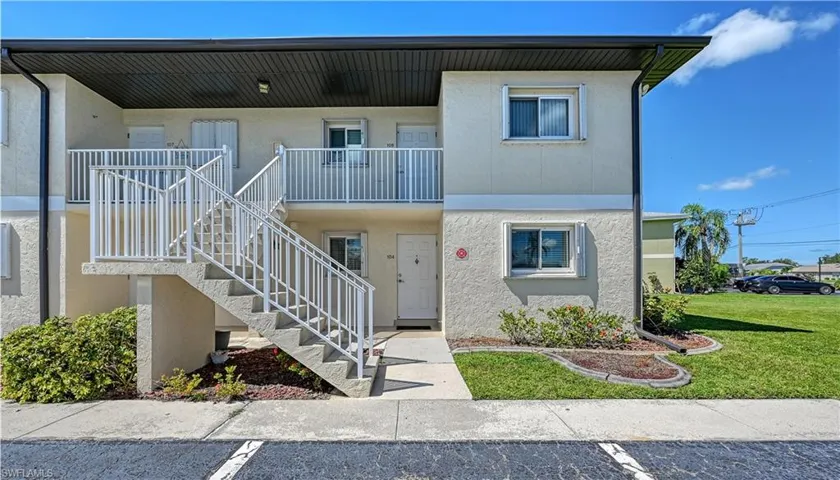 View of property with stairway