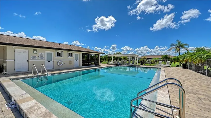 Community pool featuring a patio