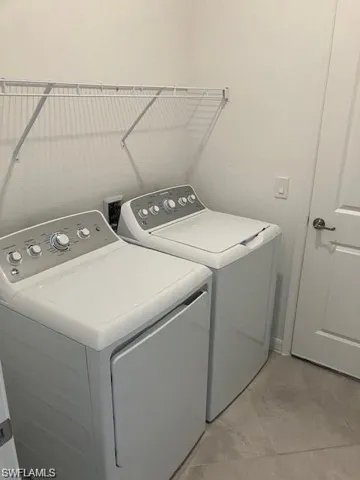 Laundry area with separate washer and dryer