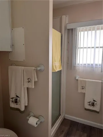 Master bath with walk in shower, and laminate flooring
