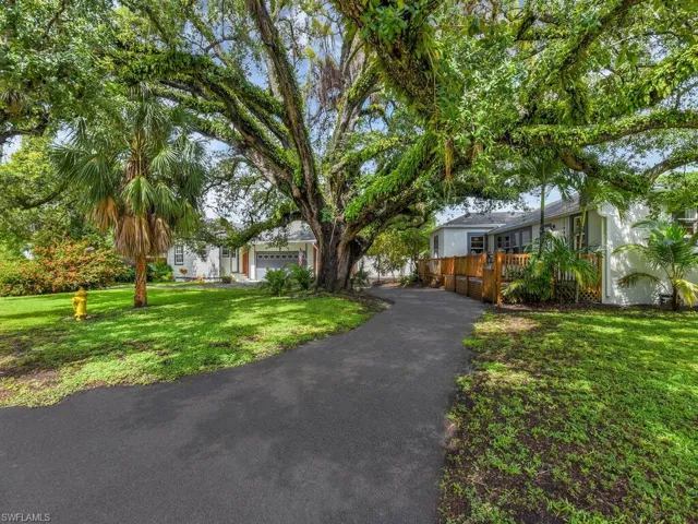 Ranch-style home featuring a front yard