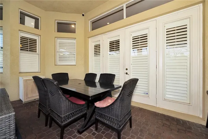 Dining room featuring brick flooring