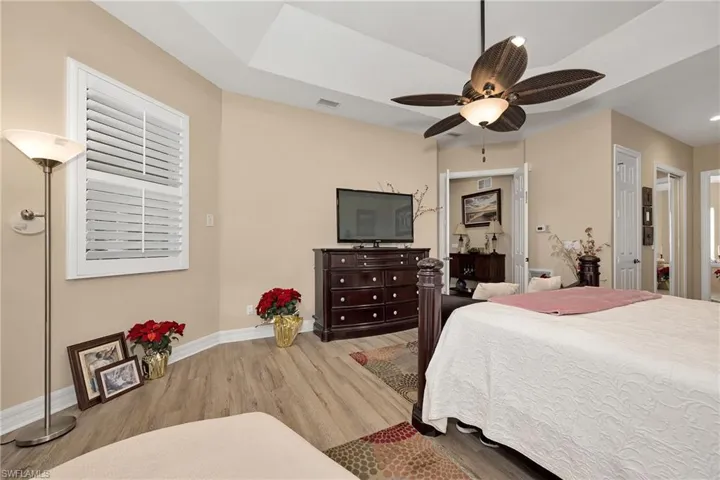 Bedroom with wood finished floors and ceiling fan