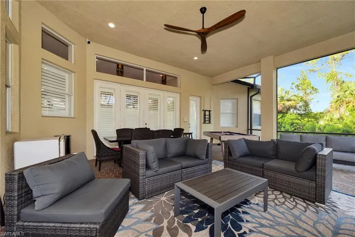 Sunroom / solarium featuring french doors