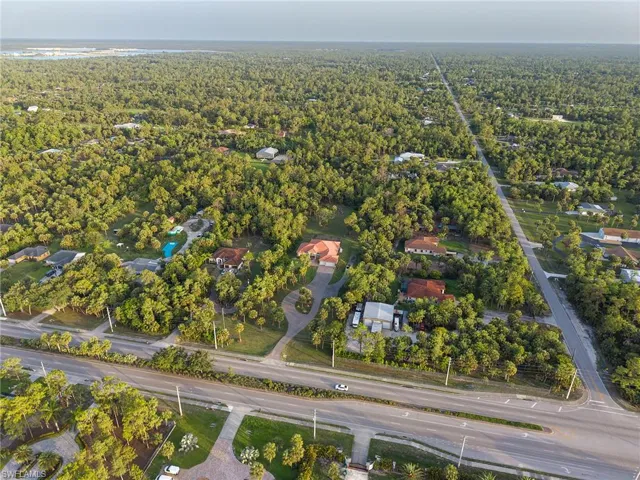 Aerial overview of property's location featuring a forest