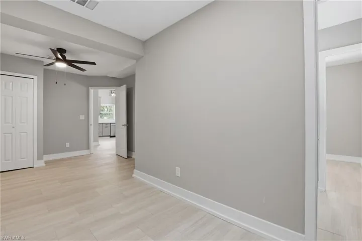 The interior features light-toned flooring and neutral gray walls, creating a versatile aesthetic