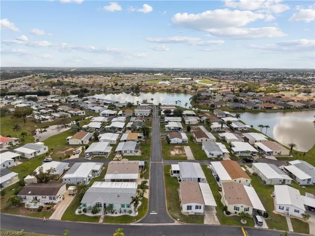 Aerial perspective of suburban area with a nearby body of water