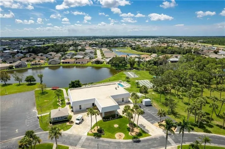 Aerial perspective of suburban area featuring a large body of water