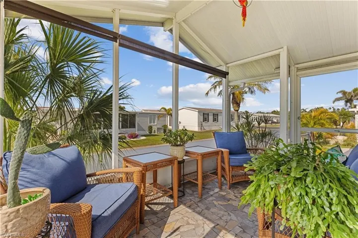 Sunroom featuring an outdoor living space