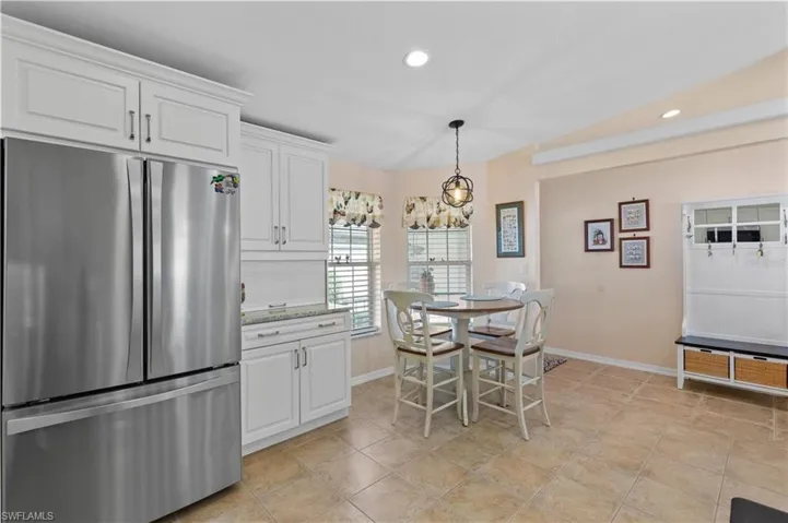 Dining room with recessed lighting and baseboards