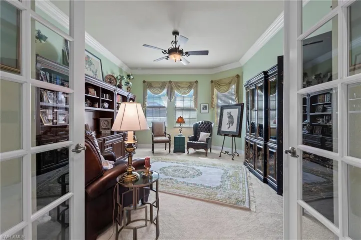 Carpeted office (5th bedroom) featuring french doors, ornamental molding, and ceiling fan