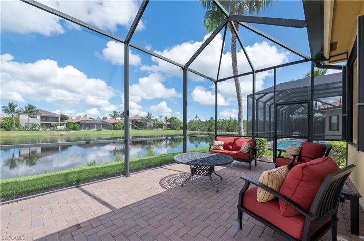 Unfurnished sunroom featuring a water view