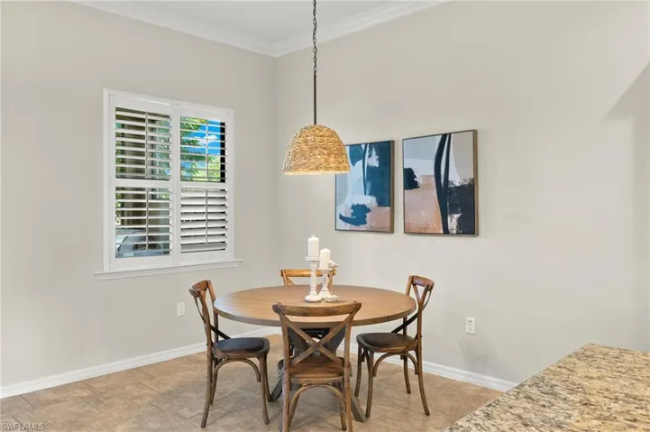 Dining area with crown molding