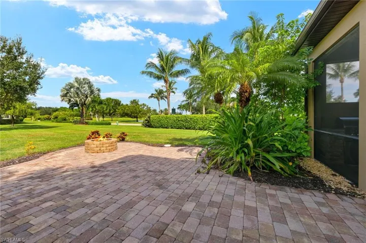 View of patio featuring an outdoor fire pit