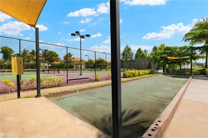 View of property's community featuring tennis court