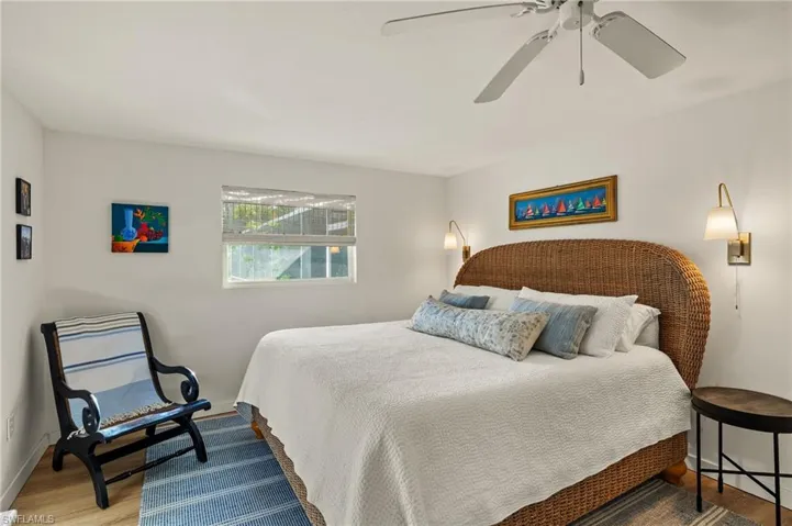 Bedroom with wood finished floors and ceiling fan