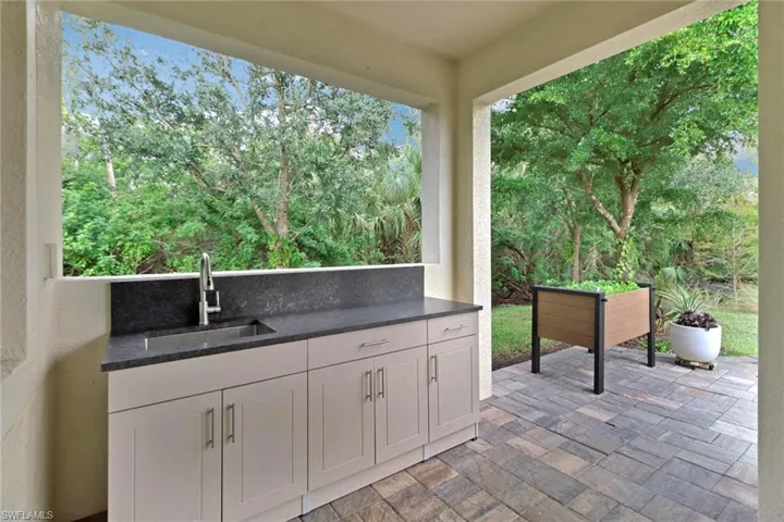 View of patio / terrace featuring sink and an outdoor kitchen