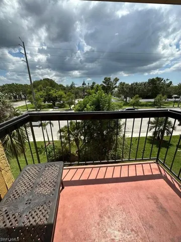 Balcony with view of wooded area