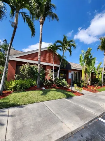 Ranch-style home with a front lawn