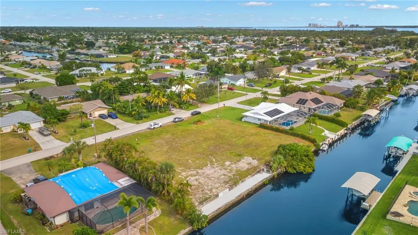 Aerial view of residential area with a nearby body of water