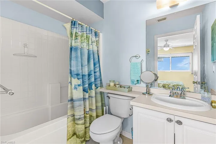 Guest ensuite bathroom with shower/bathtub combo.