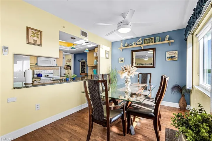 Dining area with ceiling fan and LVT flooring!