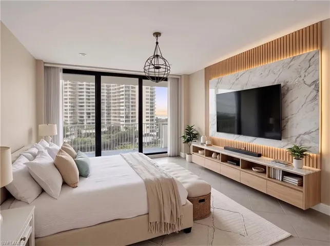 Floor-to-ceiling glass sliding doors, wall-mounted floating cabinetry with stone-surface top, vertical slat wood wall paneling, integrated backlighting, and a multi-tiered metal orb pendant light. virtually staged